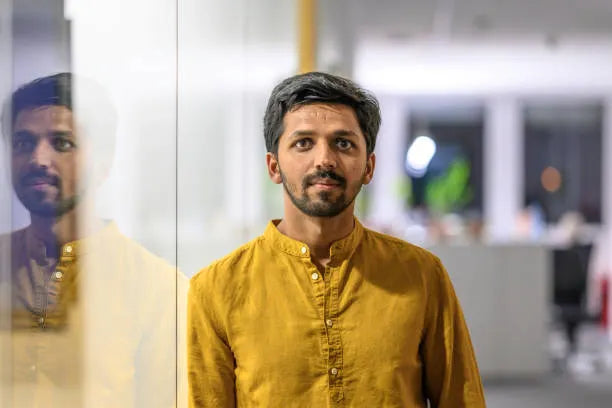 files/young-indian-man-in-office-portrait.webp